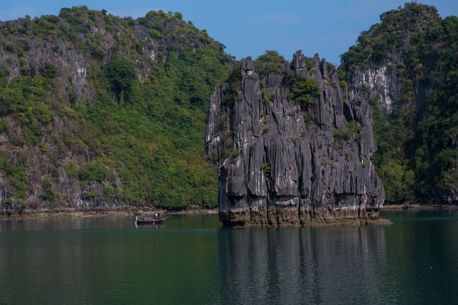 Explore the stunning limestone karst formations of Hạ Long Bay, Vietnam.